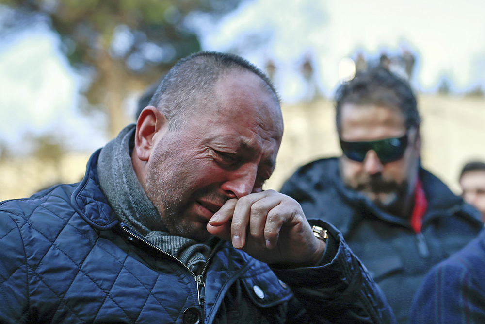 People grieve during a march to memorialize the victims of the New Year's Day nightclub attack, in Istanbul, Tuesday. Associated Press/Emrah Gurel
