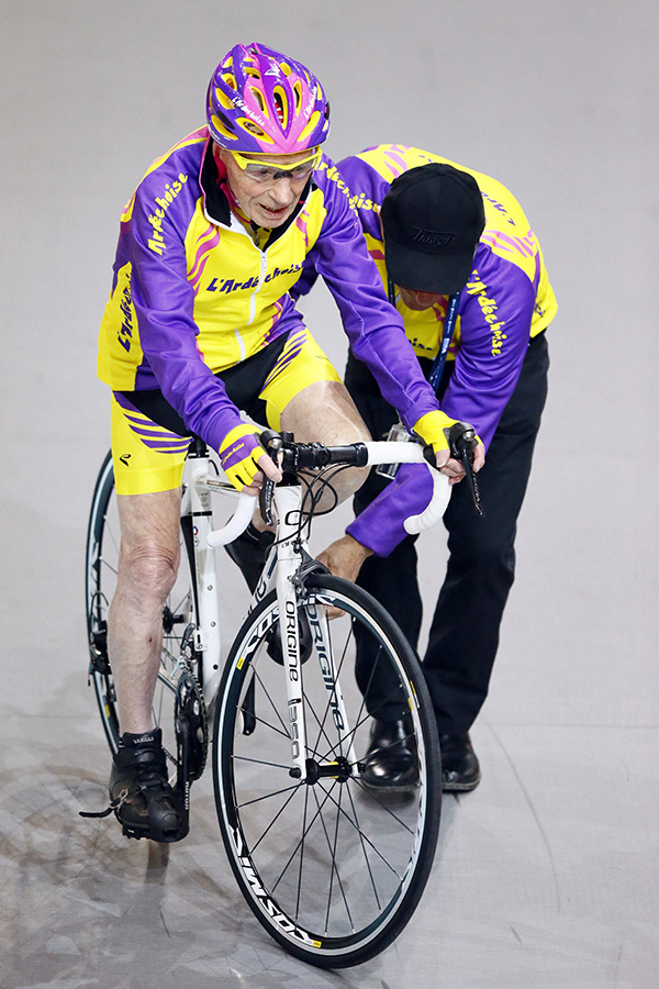 Robert Marchand mounts his bicycle before embarking on his one-hour, 14-mile feat. Associated Press/Francois Mori