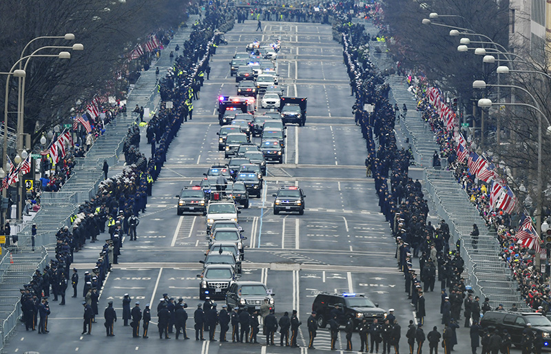 President Barack Obama and President-elect Donald Trump's motorcade drives down Pennsylvania Avenue towards the U.S. Capitol.