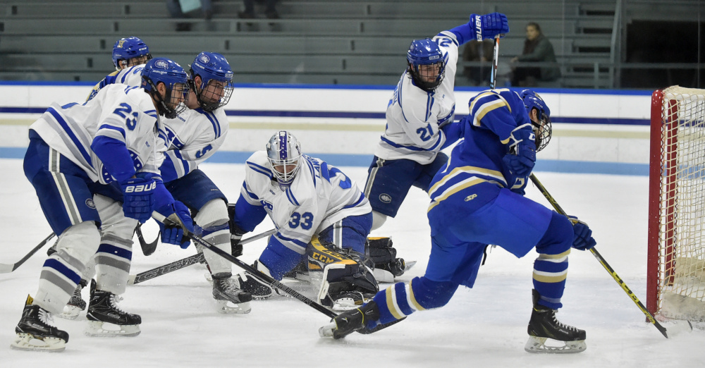 Colby goalie Sean Lawrence (33) makes a save against Hamilton in the first period Friday.