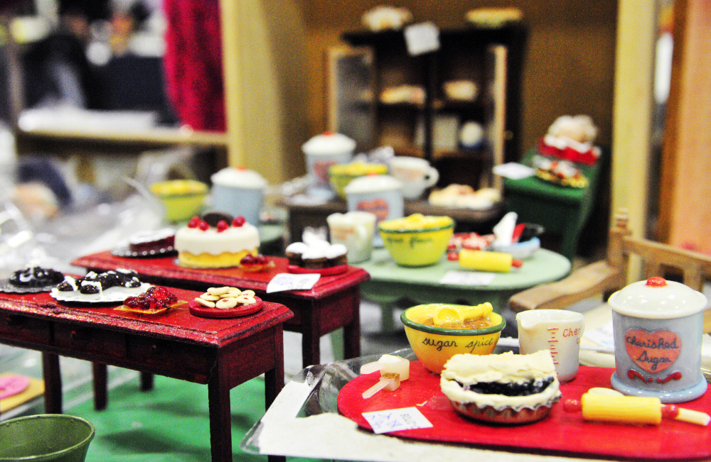 Kathy Allen makes and sells accessories to furnish dollhouses on display Saturday during the 31st annual Whitefield Lions Club Model Railroad and Doll House Show at the Augusta State Armory.