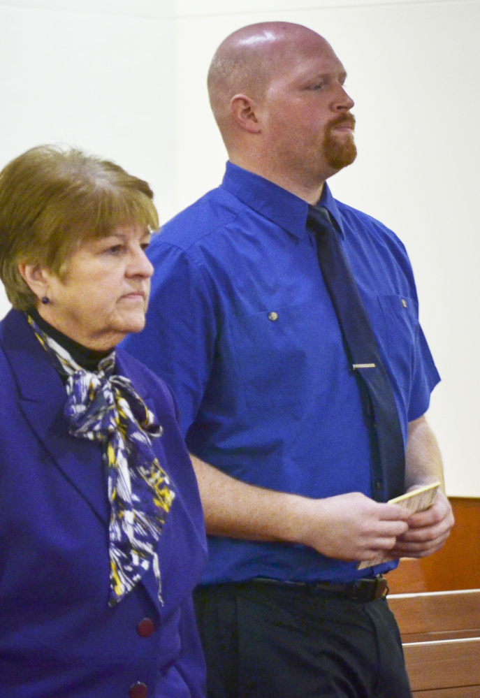 Lucas Savage, charged with unlawful sexual contact, and his attorney, Pamela Ames, listen to instructions at the Capital Judicial Center in Augusta on Tuesday.