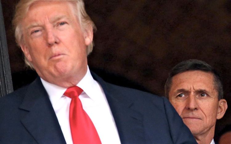 Michael Flynn appears with President-elect Donald Trump in December. Senate Majority Leader Mitch McConnell said Tuesday that it is "highly likely" that Flynn's departure will be added to a broader probe into Russian meddling with the presidential election.