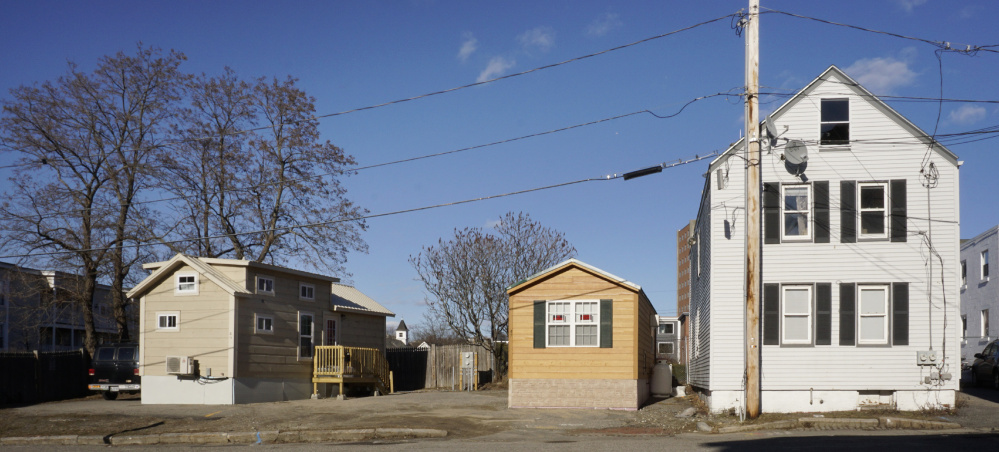 Portland officials are asking a District Court judge to order the removal of these two homes on Chapel Street and levy a fine against lot owner Brent Adler. It's the first time Maine's largest city has had to tackle zoning issues surrounding the movement toward smaller living spaces.