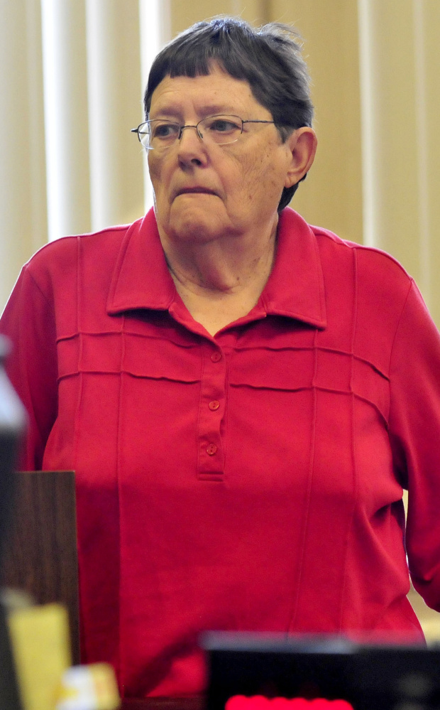 Mary O'Donal listens to Justice Robert Mullen during sentencing Thursday after her conviction of theft from Care and Share Food Closet in Farmington.