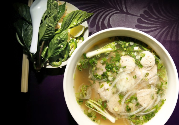 Pho with rare beef and meatballs.