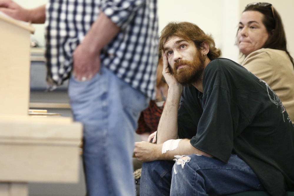 Garry Godfrey of Milford listens as Dawson Julia testifies before a legislative committee in support of a bill to prohibit policies excluding medical marijuana patients from organ donations. Julia is a medical marijuana caregiver in Unity.