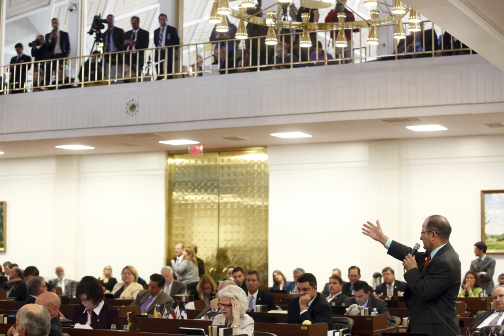 Rep. Michael Speciale, R- Craven, debates on the floor of the the North Carolina State House prior to a vote on HB 142 on Thursday in Raleigh. Lawmakers voted Thursday to roll back North Carolina's "bathroom bill" in a bid to end the backlash over transgender rights that has cost the state dearly in business projects, conventions and basketball tournaments.