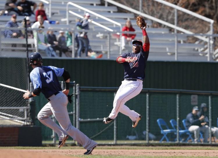 Sea Dogs' Rafael Devers makes the catch  during an April 23 game against the Trenton Thunder at Hadlock Field in Portland.