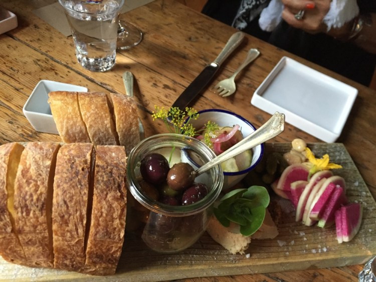 Bread, olives and other nibbles are served at The Lost Kitchen in Freedom before the meal begins.