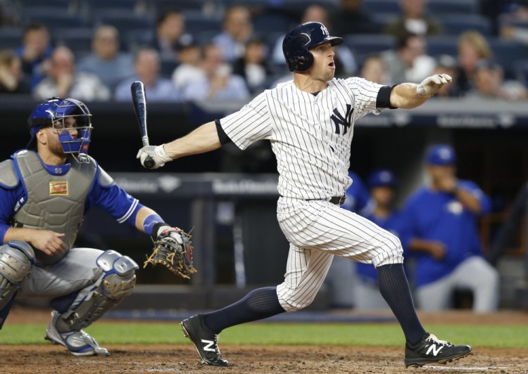 Brett Gardner watches his two-run home run off Toronto's Mat Latos in the second inning Tuesday night in New York. Gardner also hit a homer in the fourth inning of an 11-5 Yankees' win.