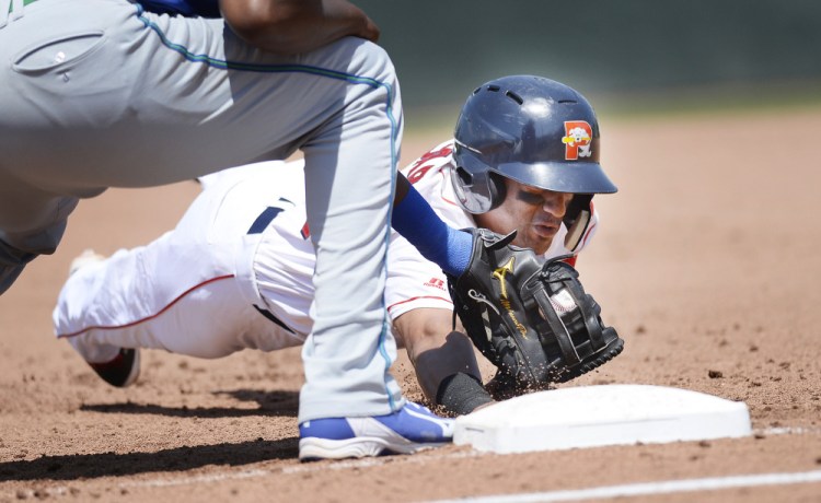 Jose Rosario of the Portland Sea Dogs is picked off at first base during Thursday's game against Hartford at Hadlock Field in Portland. The Yard Goats rallied for two runs in the eighth inning and won, 4-3. (Staff photo by Shawn Patrick Ouellette/Staff Photographer)