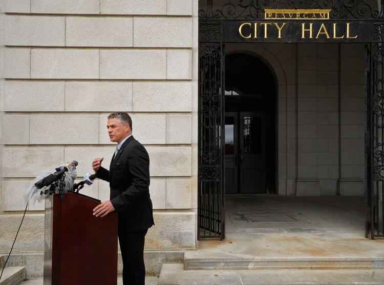 Mayor Ethan Strimling holds a news conference outside Portland City Hall on Monday to announce the creation of a task force to study the city's charter. Strimling says the task force's interpretation of the charter could help smooth the contention that has developed between him, City Manager Jon Jennings and the City Council members.