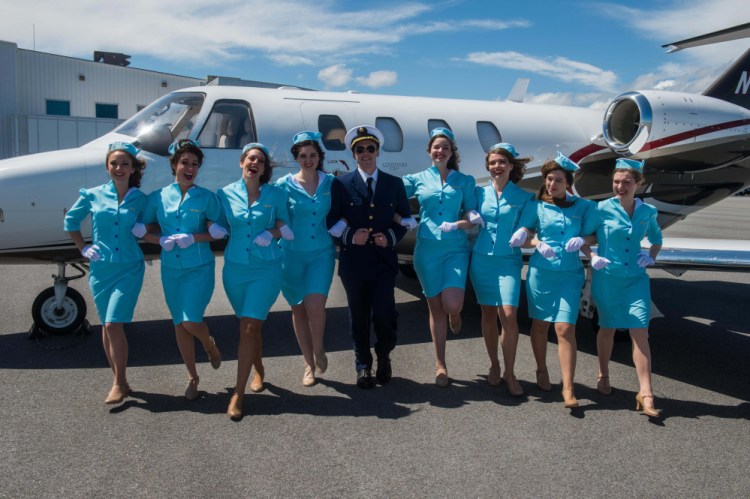 Eric Berry-Sandelin as Frank Abagnale Jr., center, with stewardesses: Shannon Oliver, Jenny Brown, Ashley Taylor, Lauren Tudor, Joanna Clarke, Sarah Kennedy, Jericah Potvin and Jocelyn Handy.