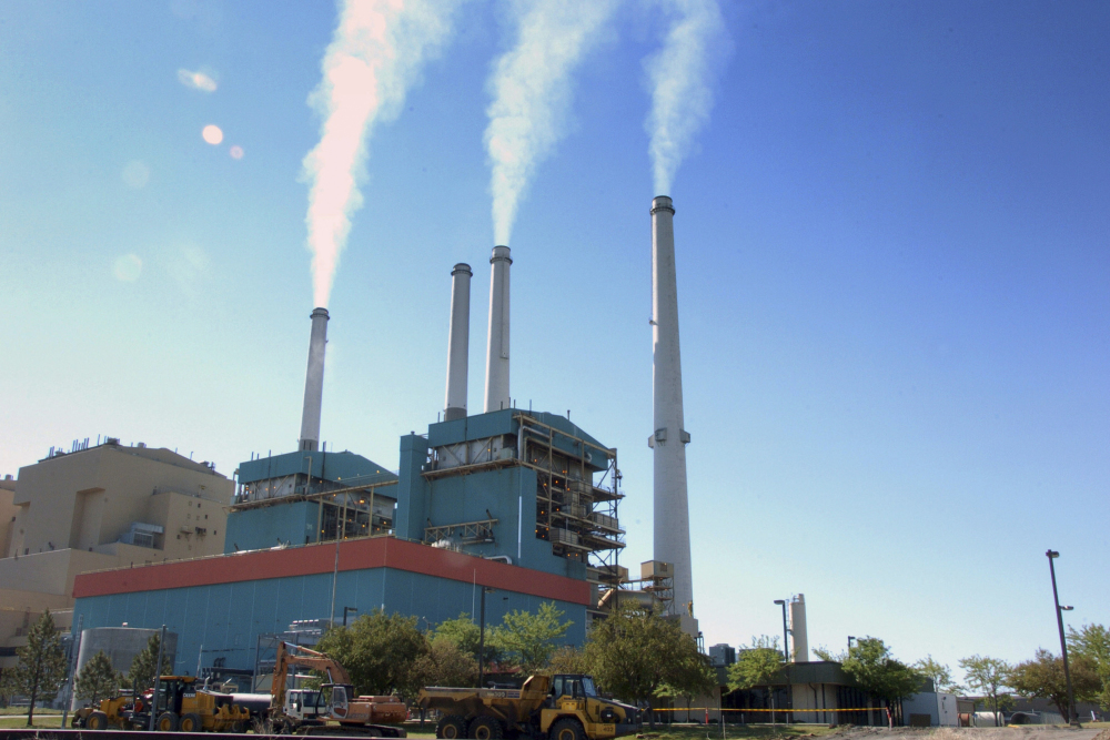 Smoke rises from the Colstrip Steam Electric Station, a coal-burning power plant in Colstrip, Mont., in 2013. U.S. coal production fell to 739 million tons last year, the lowest in almost four decades, amid growing competition from natural gas, wind generation and solar power. From 2011 through 2016, the coal mining industry lost an estimated 60,000 jobs.