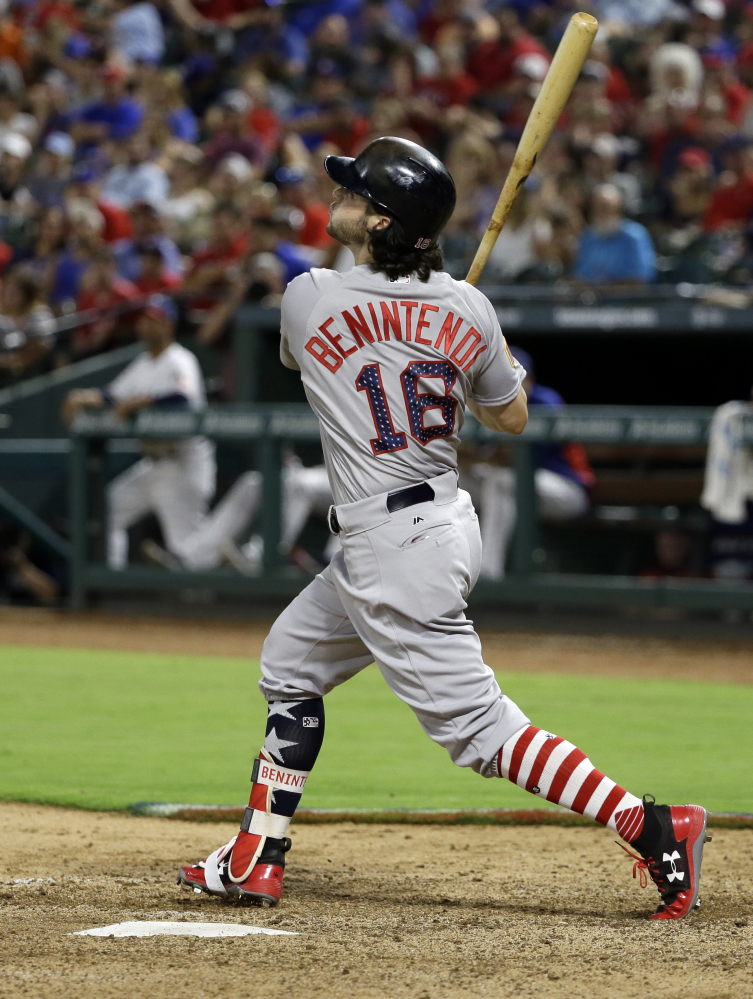 Boston's Andrew Benintendi hits a two-run single in the 11th inning to give the Red Sox a 7-5 lead. The hit proved to be the game winner.