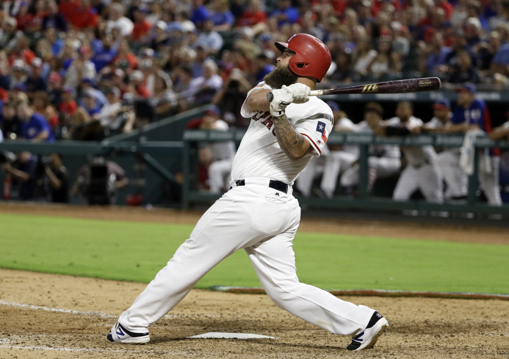 The Rangers' Mike Napoli blasts a solo home run off Red Sox closer Craig Kimbrel to tie the game in the ninth inning. It was Napoli's 17th home run of the season and a blown save for Kimbrel.
Associated Press/Tony Gutierrez