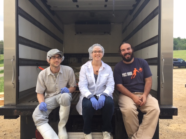 Aron Gonsalves, at right with Robert and Emily Sharood, is the farm’s operation’s manager.