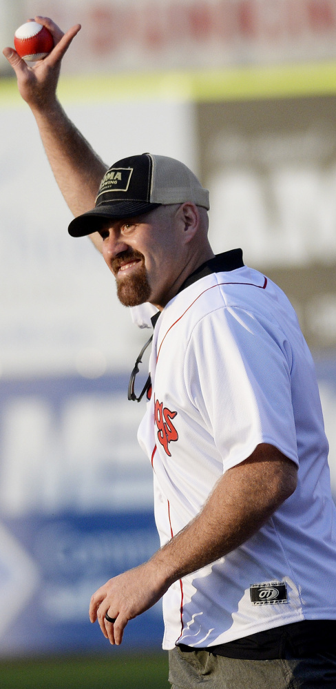 Kevin Youkilis, the former Portland Sea Dog who won two World Series with the Red Sox, acknowledges the crowd Tuesday night while throwing out the first pitch at Hadlock Field.