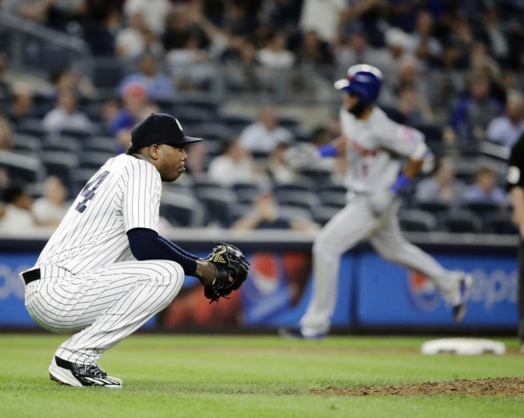 Yankees closer Aroldis Chapman reacts as Amed Rosario of the Mets runs the bases after hitting a two-run homer off Chapman in the ninth inning Tuesday. The Yankees held on to win, 5-4.