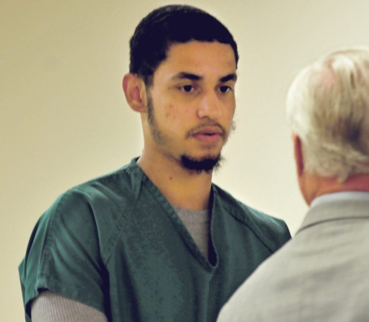 Defendent Dreaquan Foster on Thursday consults with his attorney, Thomas Tilton, during his arraignment at the Capital Judicial Center in Augusta on charges related to a Sidney home invasion last spring.