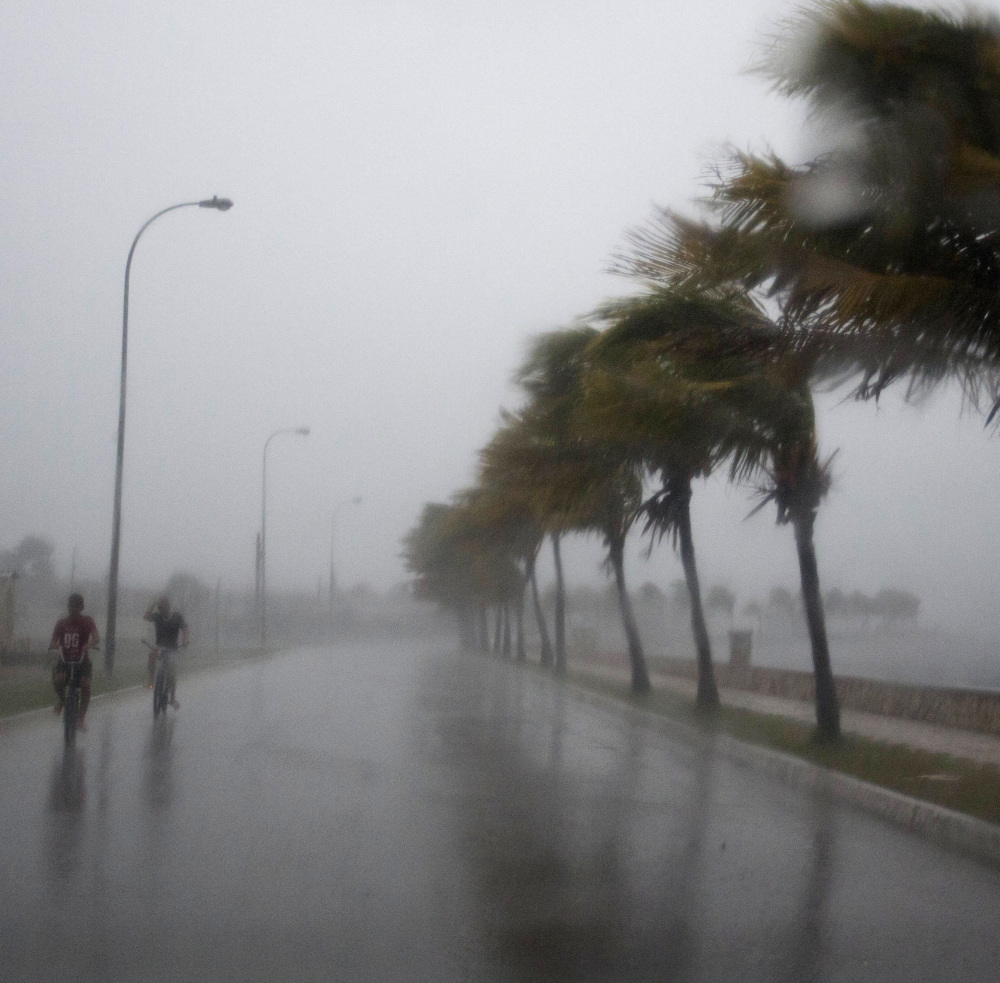 Caibarien, Cuba, gets a dose of Irma's winds on Friday, while Havana, left, is battered by the storm surge on Saturday.