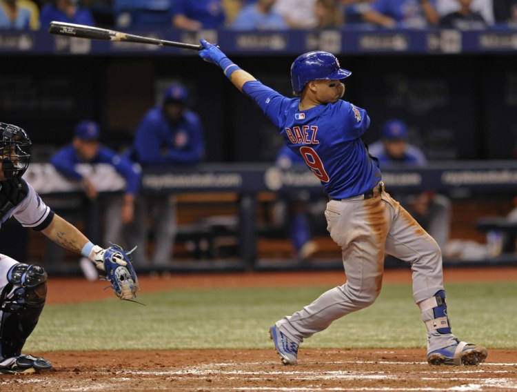 Javier Baez of the Cubs hits an RBI double against the Rays in the fourth inning Tuesday night in St. Petersburg, Fla.