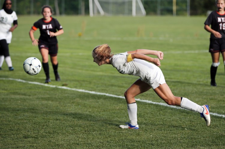 Ava Farrar sends the ball toward the net off a header Friday, scoring one of her five goals for Waynflete in a 9-0 victory against North Yarmouth Academy in a Western Maine Conference girls' soccer game.