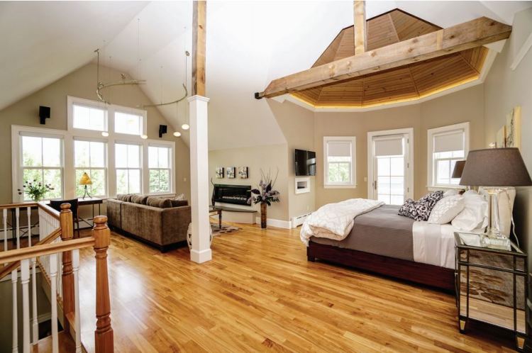 The master suite’s bedroom and sitting area. 