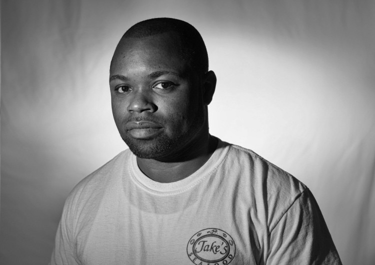 Leanord Thompson of Jamaica cooks at Jake's Seafood restaurant in Wells as a temporary seasonal worker. He also works in Arizona and misses his family and friends. “But it’s working. You are not doing this for yourself anymore,” he said. 