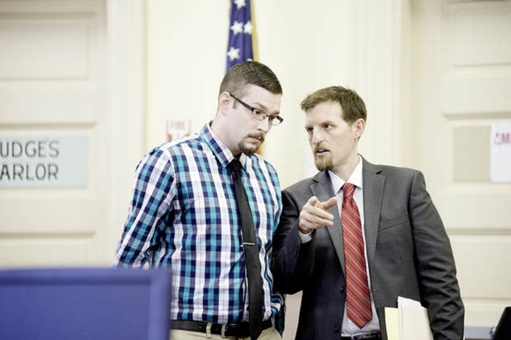 Timothy Danforth, left, talks with his co-counsel, Jeffrey Wilson, before the start of Danforth's murder trial in Franklin County Superior Court on Sept. 25.