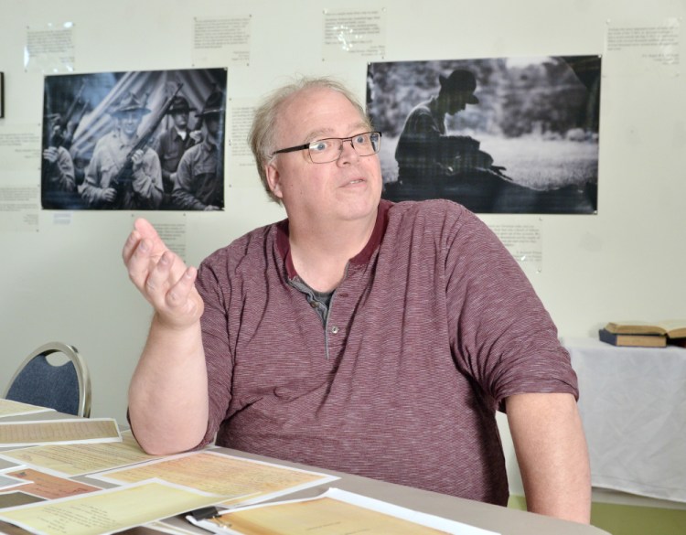 Program director David Greenham talks about the "World War One: Letters Home" exhibit during interview Thursday at the Holocaust and Human Rights Center of Maine in Augusta.