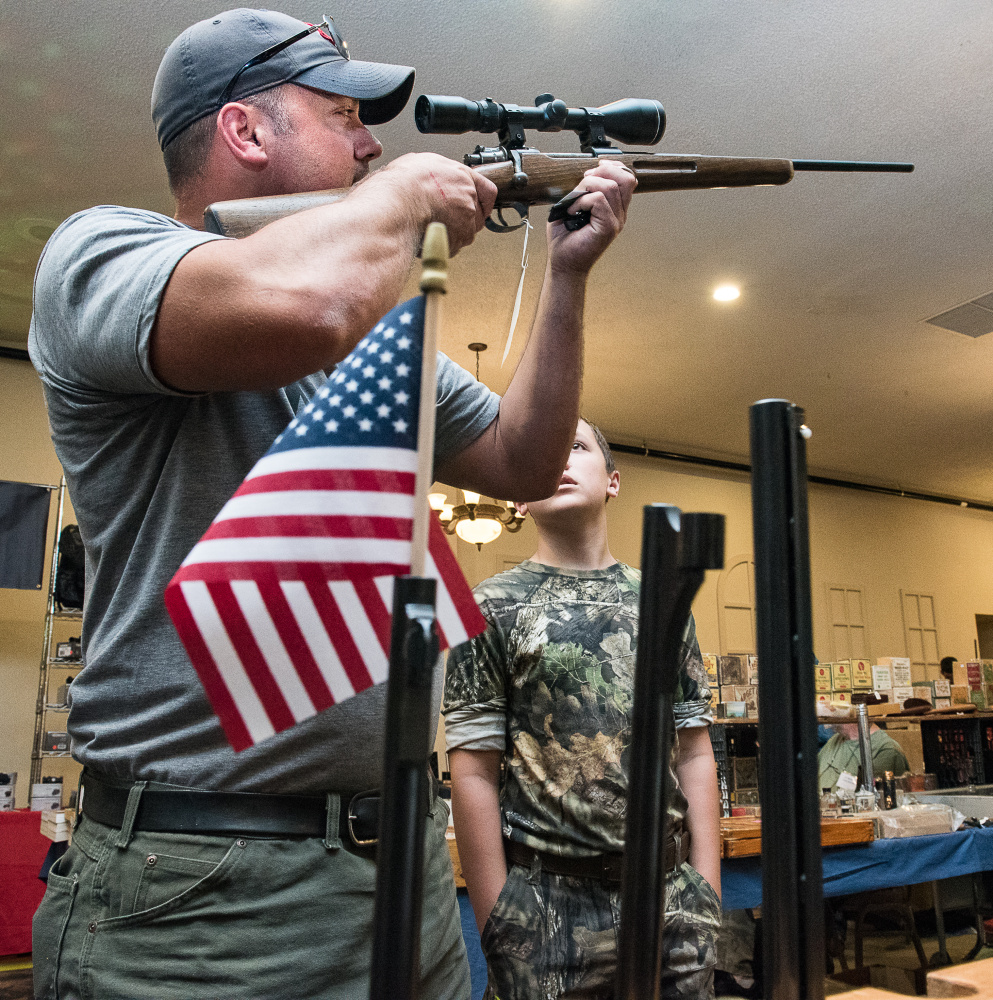 Dana Hodgdon and his son, Tyler, 12, of Norway, came to the Ramada Inn in Lewiston on Saturday to look for deals at J.T. Reid Gun Show, which will continue Sunday from 9 a.m. to 3 p.m.