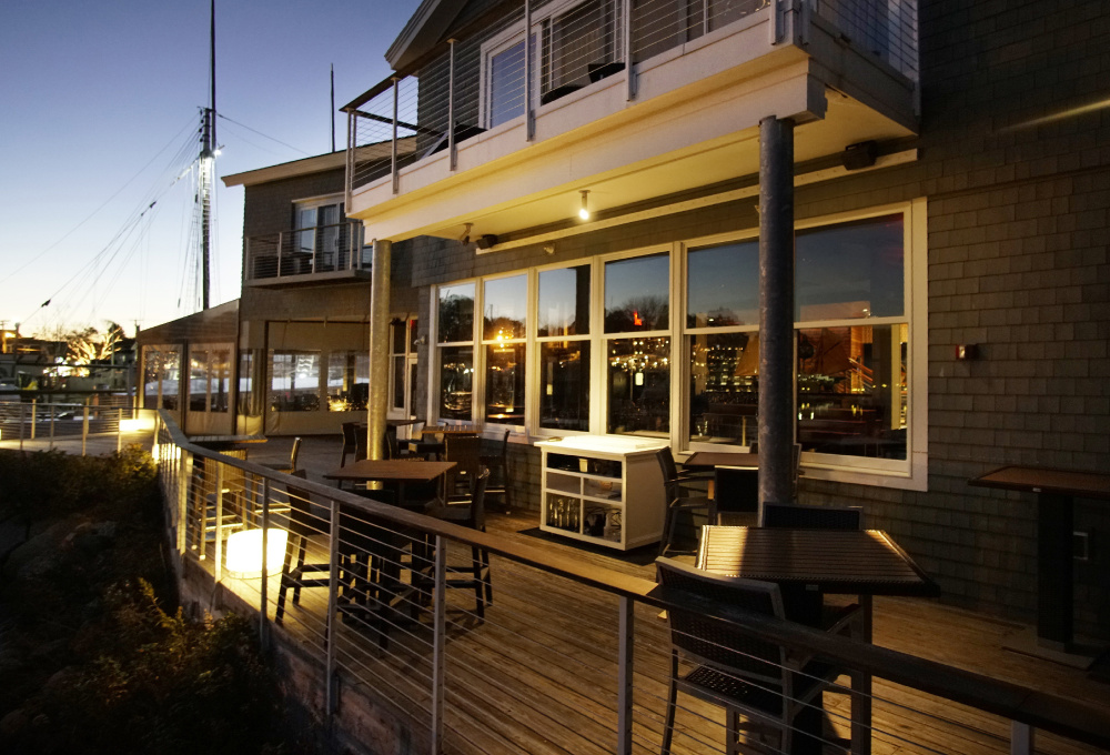 Dockside tables are empty Tuesday evening at David's KPT in Kennebunkport, which closed for good on Monday. About 45 full-time employees lost their jobs.