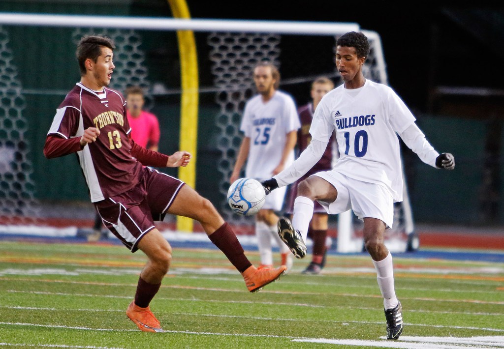 Thornton Academy's Frank Vondrak and Portland's Zekariya Shaib try to control the ball during play in the first half at Portland.