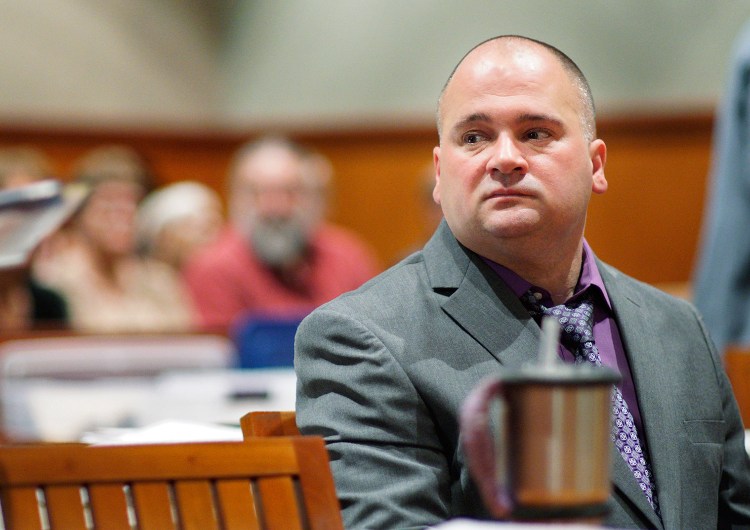 Anthony Sanborn looks to his attorney Amy Fairfield at the start of his post-conviction review on Oct. 10 at the Cumberland County Courthouse. After serving 27 years in prison, Sanborn was released on bail in April pending a review of his case.