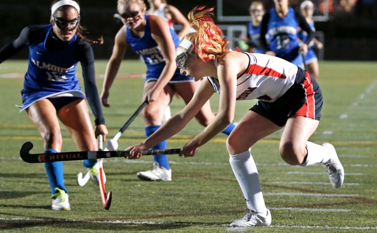 Scarborough forward Carrie Timpson crosses sticks with Falmouth defenders Juliana LaPorta, left, and Caitlin Bull on Tuesday at Scarborough. The Red Storm bested Falmouth, 1-0. 