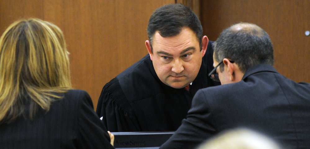 Superior Court Justice Eric Walker confers Nov. 29, 2016, with Kennebec County Assistant District Attorney Tracy DeVoll and defense attorney Charles T. Ferris during the Augusta civil trial of Danielle Jones, co-owner of the two dogs involved in an attack that killed another dog.