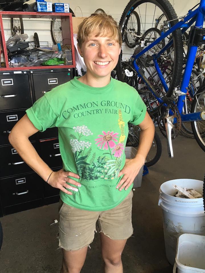 Portland Gear Hub and Bike School Program Director Ainsley Judge takes a break from painting the shop’s facade.