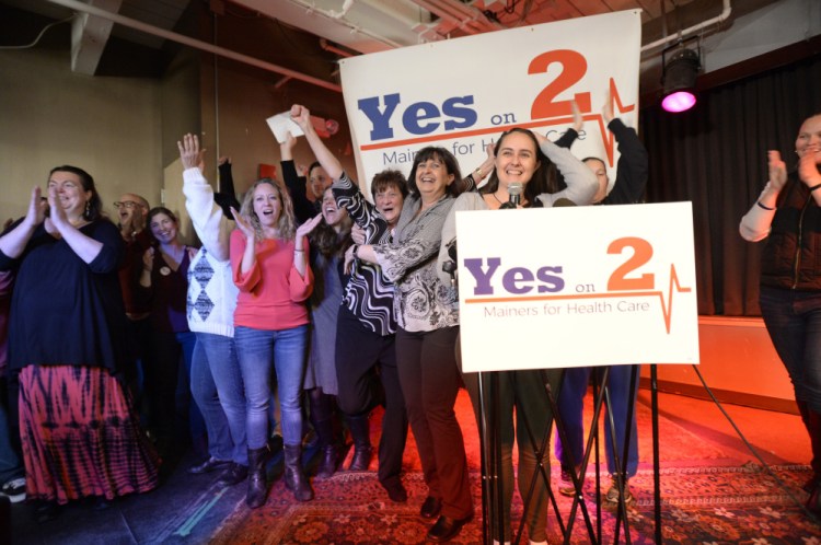 Supporters of Medicaid expansion cheer on Election Day in November while awaiting voting results at the Mainers for Health Care party in Portland. Maine voters decided to expand Medicaid under the Affordable Care Act, but Gov. Paul LePage has insisted that the Legislature fund expansion costs without tapping into the state’s rainy day fund or increasing taxes. 