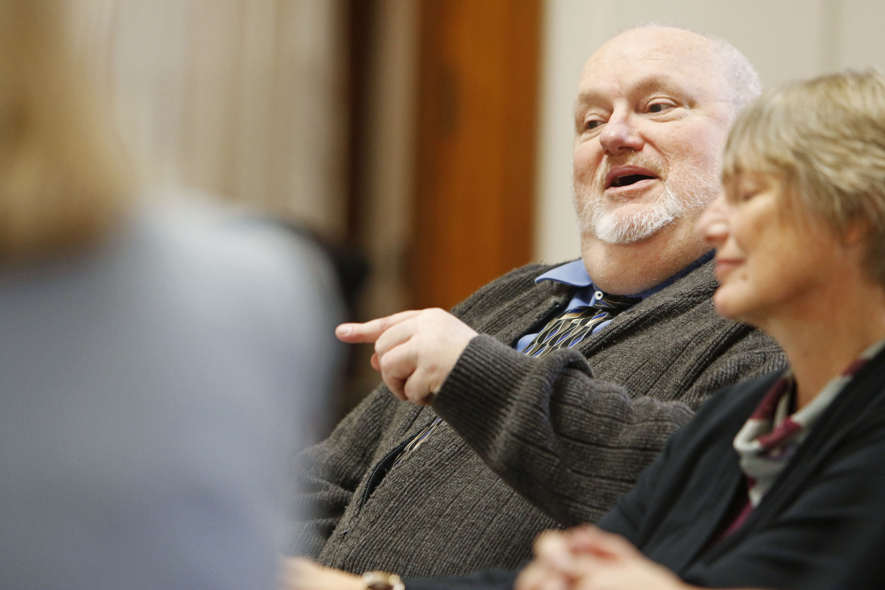 Bob Wellington,  a representative of Agri-Mark Dairy Cooperative, discusses the effects on agricultural cooperatives in Maine during a round table meeting with U.S. Rep. Chellie Pingree at Portland City Hall regarding the Republican tax plan on Monday.