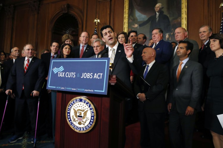 House Speaker Paul Ryan of Wis., joined by House Republicans, speaks to the media following a vote on tax reform on Thursday on Capitol Hill in Washington. Among the members present are, House Majority Whip Steve Scalise, R-La., House Majority Leader Kevin McCarthy of Calif., House Ways and Means Chair Rep. Kevin Brady, R-Texas, and Rep. Cathy McMorris Rodgers, R-Washington.