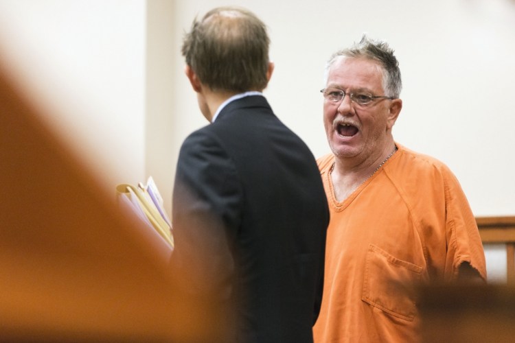 Theodore Thomes, standing next to his lawyer, Devens Hamlen, speaks on his own behalf during a hearing Friday at the Cumberland County Courthouse.