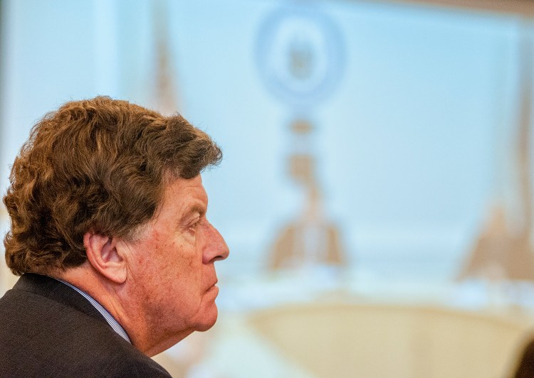 Public Advocate Barry Hobbins listens to deliberations during a Maine Public Utilities Commission meeting on Tuesday in Hallowell.  The PUC has opened an inquiry into responses by the state's electric companies in restoring power after October's destructive storm.