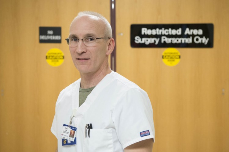 Eric Hewett, a surgery nurse at Inland Hospital, poses for a portrait at Inland Hospital on Dec. 22. Hewett was hit multiple times in the head while apprehending a man who broke in to his mother's home in Sidney in March.