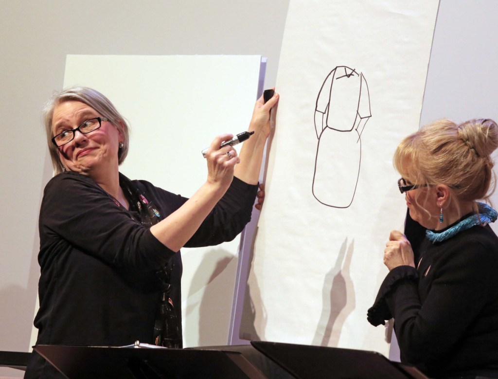 Amy Roche draws while Lynne McGhee watches in the show on stage at St. Lawrence Arts.