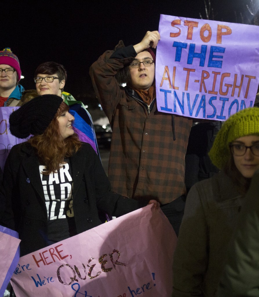 Demonstrators protest last February outside a University of Southern Maine lecture hall during state Rep. Lawrence Lockman's talk, "Alien Invasion: Fixing the Immigration Crisis." Campuses should welcome a wide range of speakers, UNE's president says.