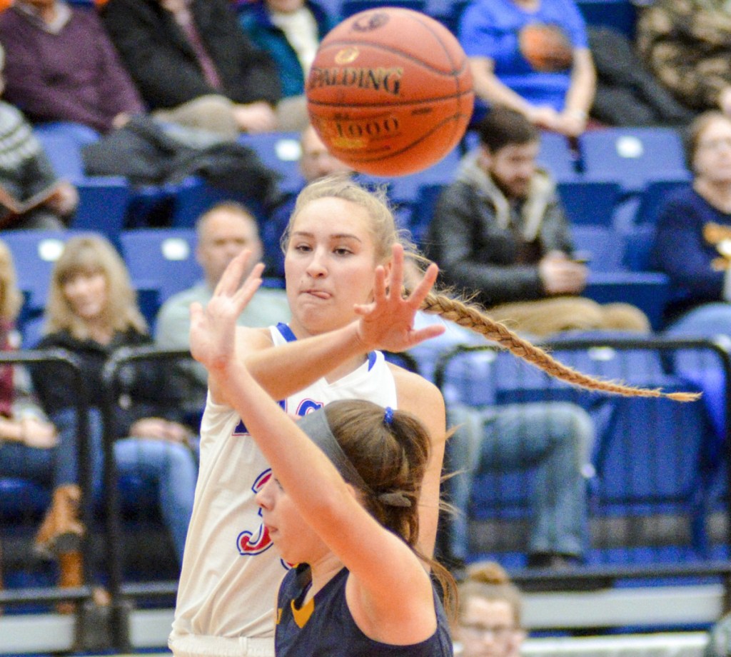 Gabrielle Wener, who finished with 29 points for Messalonskee, passes over Aubrey Schaeffer of Medomak Valley. Messalonskee will meet Skowhegan next.