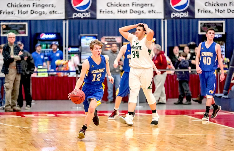 Boothbay's Kyle Ames kills off the last few seconds to secure a 65-64 victory over Waynflete in a Class C South boys' basketball quarterfinal Monday afternoon at the Augusta Civic Center.