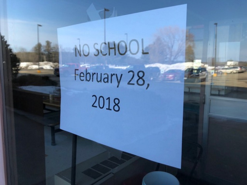 Notice posted on the front door at Skowhegan Area High School Wednesday following an online threat Tuesday night, showing an image of an AR-15 assault rifle and a menacing message that "You're all DEAD."